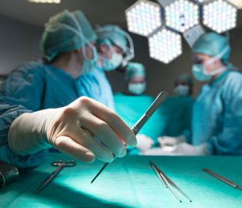 Surgeons in full surgical gear during operation